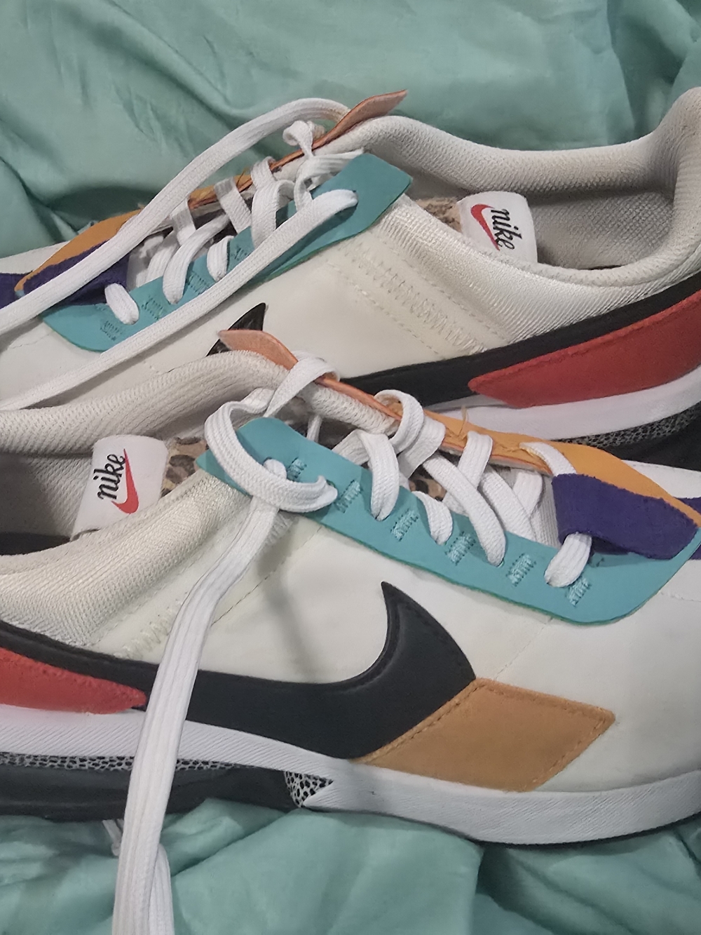 Nike Womens White Sneakers with Teal, Orange, Purple & Black Accents